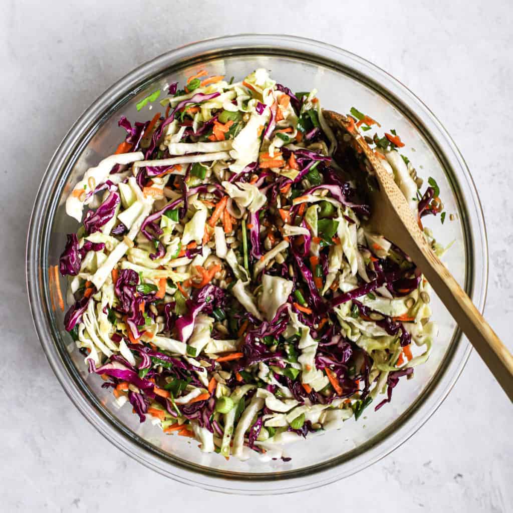 Healthy coleslaw made with oil and vinegar as an alternative to mayo, in a bowl.