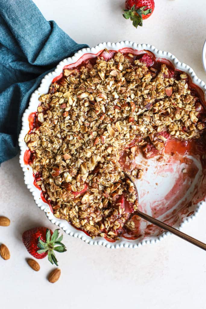 Fresh and wholesome strawberry crisp in a white baking dish.