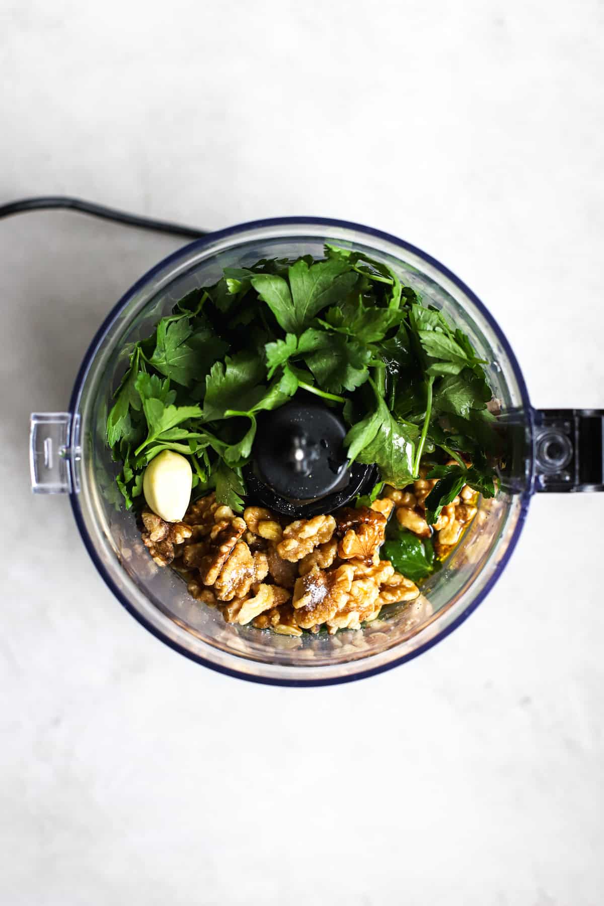 Parsley pesto ingredients in food processor