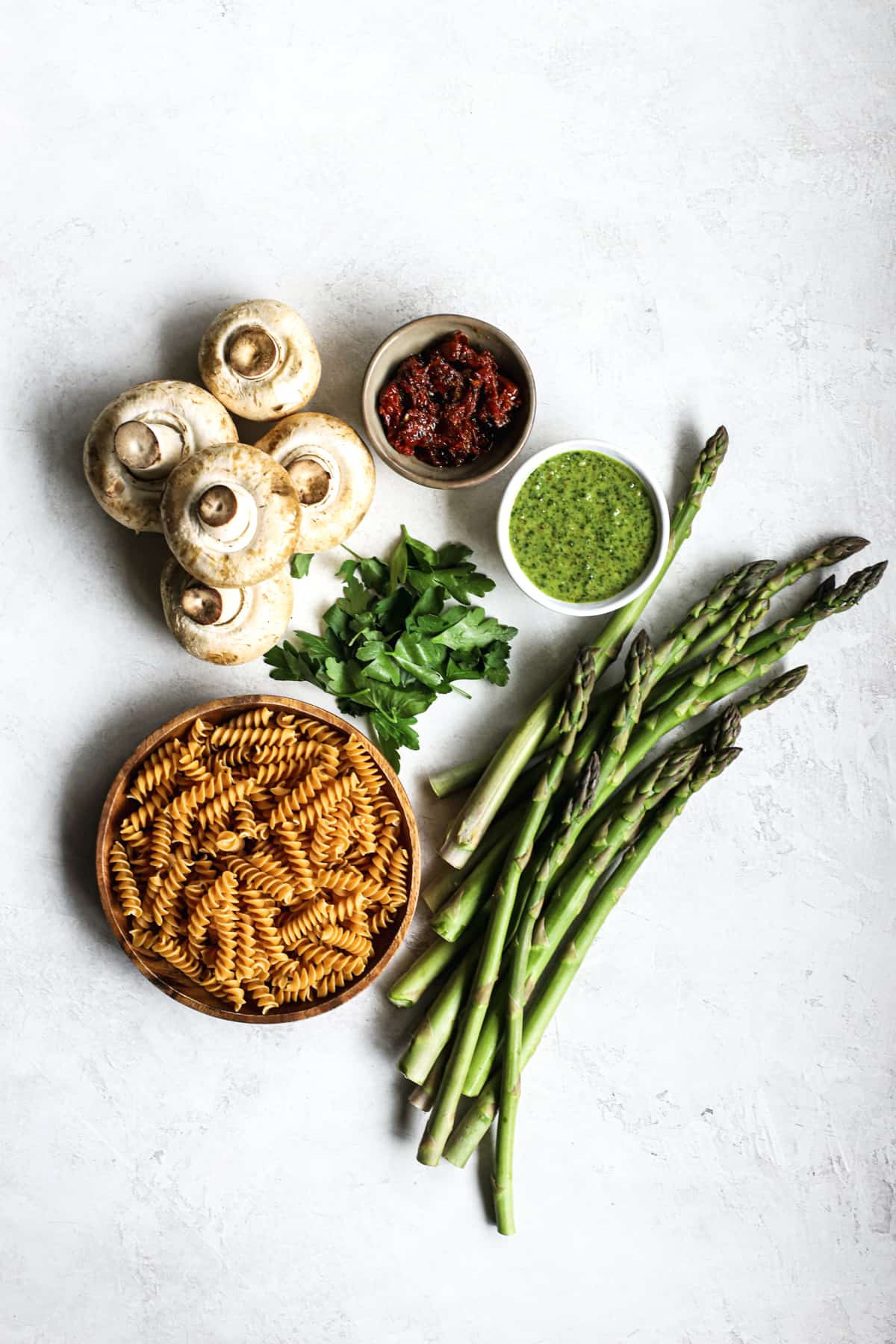 Ingredients for pesto pasta with spring roasted veggies