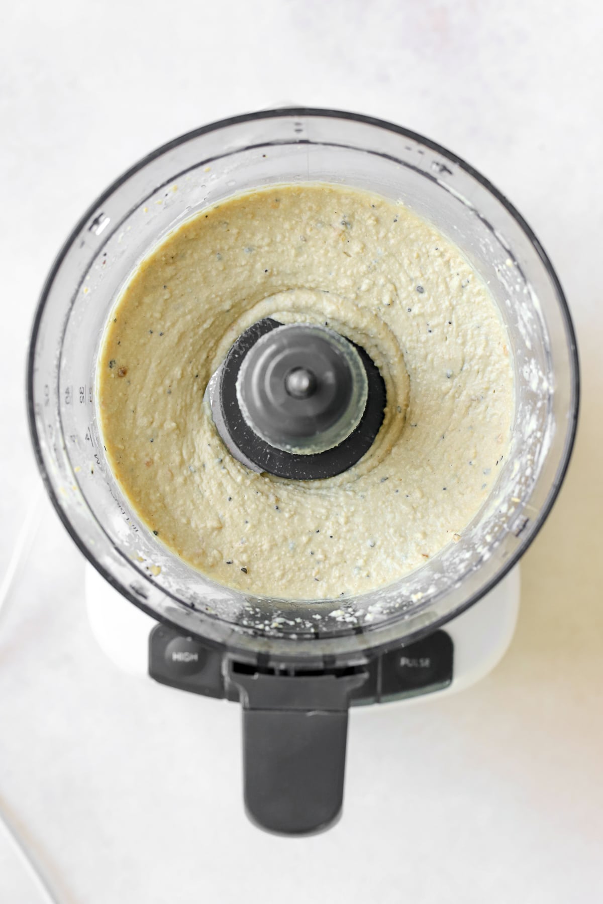 Hummus blended smoothly food processor.
