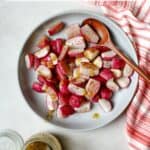 Roasted radishes tossed with vinaigrette in blue bowl.