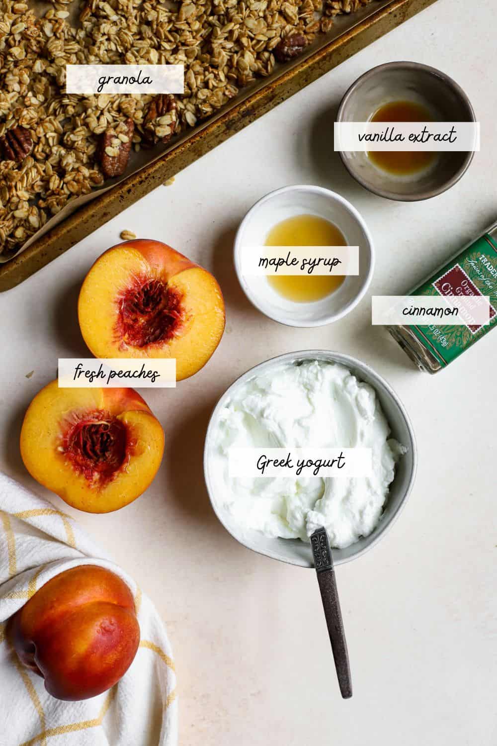 Fresh peaches, yogurt, cinnamon, maple syrup, vanilla extract, and granola for making yogurt bowls.