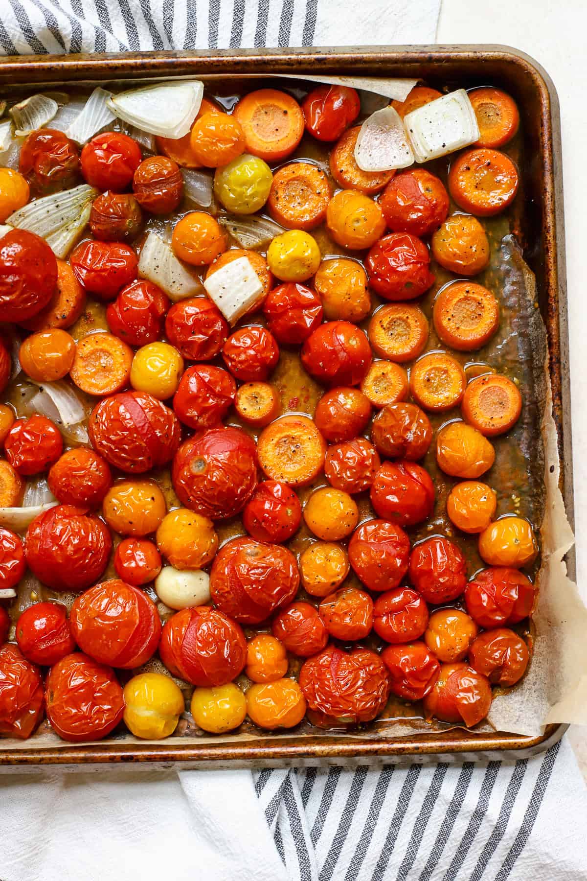 Roasted tomato soup veggies on sheet pan.