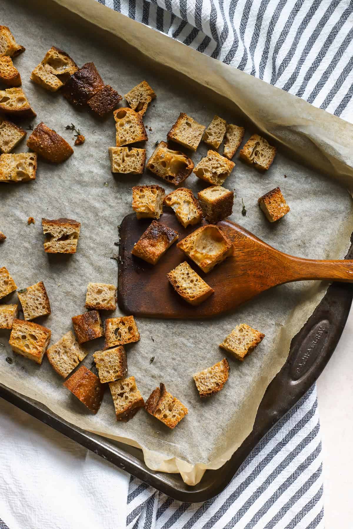 Homemade sourdough croutons on sheet pan.