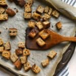 Homemade sourdough croutons on sheet pan.