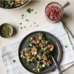 Black bean quinoa salad on gray plate with fork.