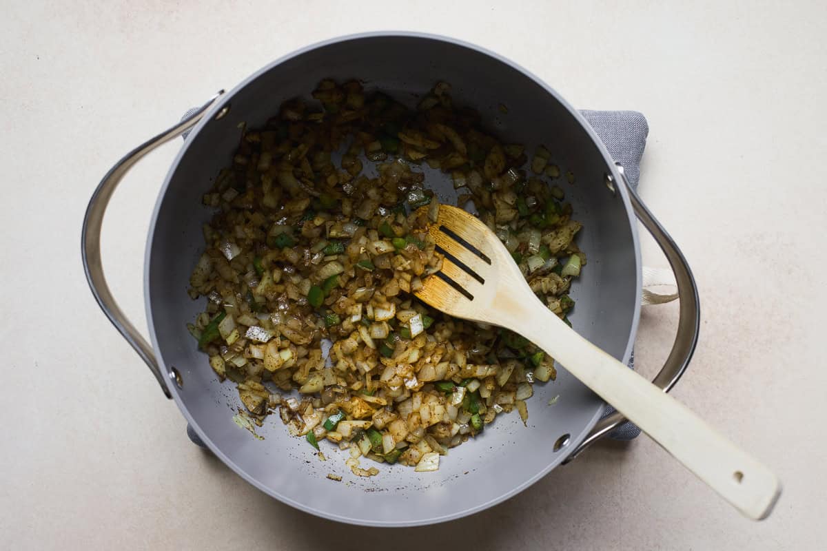 Sautéing onion, jalapeño, garlic, and spices for tortilla soup.