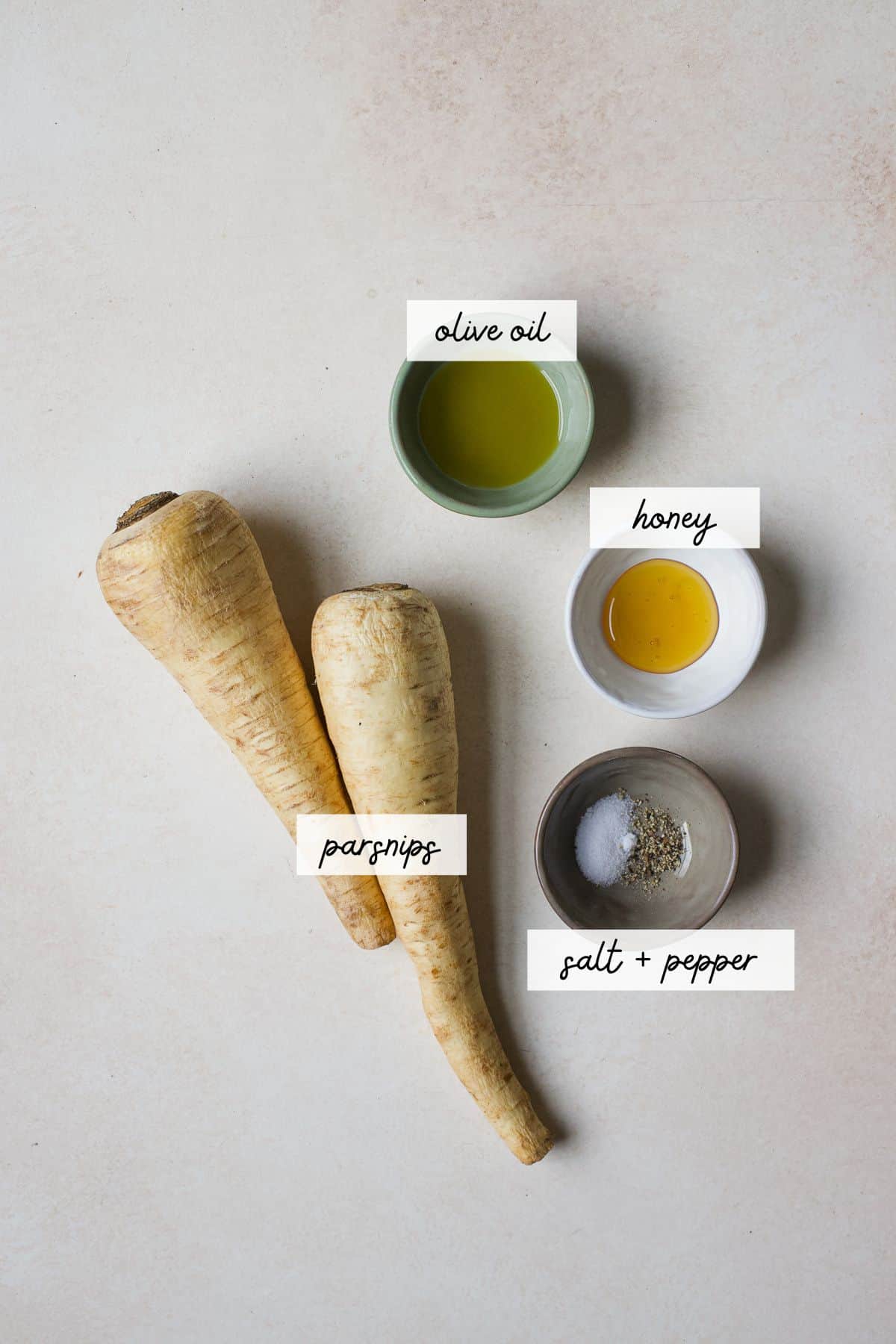Ingredients needed to make honey roasted parsnips.