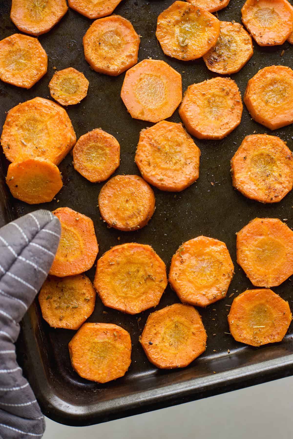 Roasted Moroccan carrots on sheet pan just out of the oven.