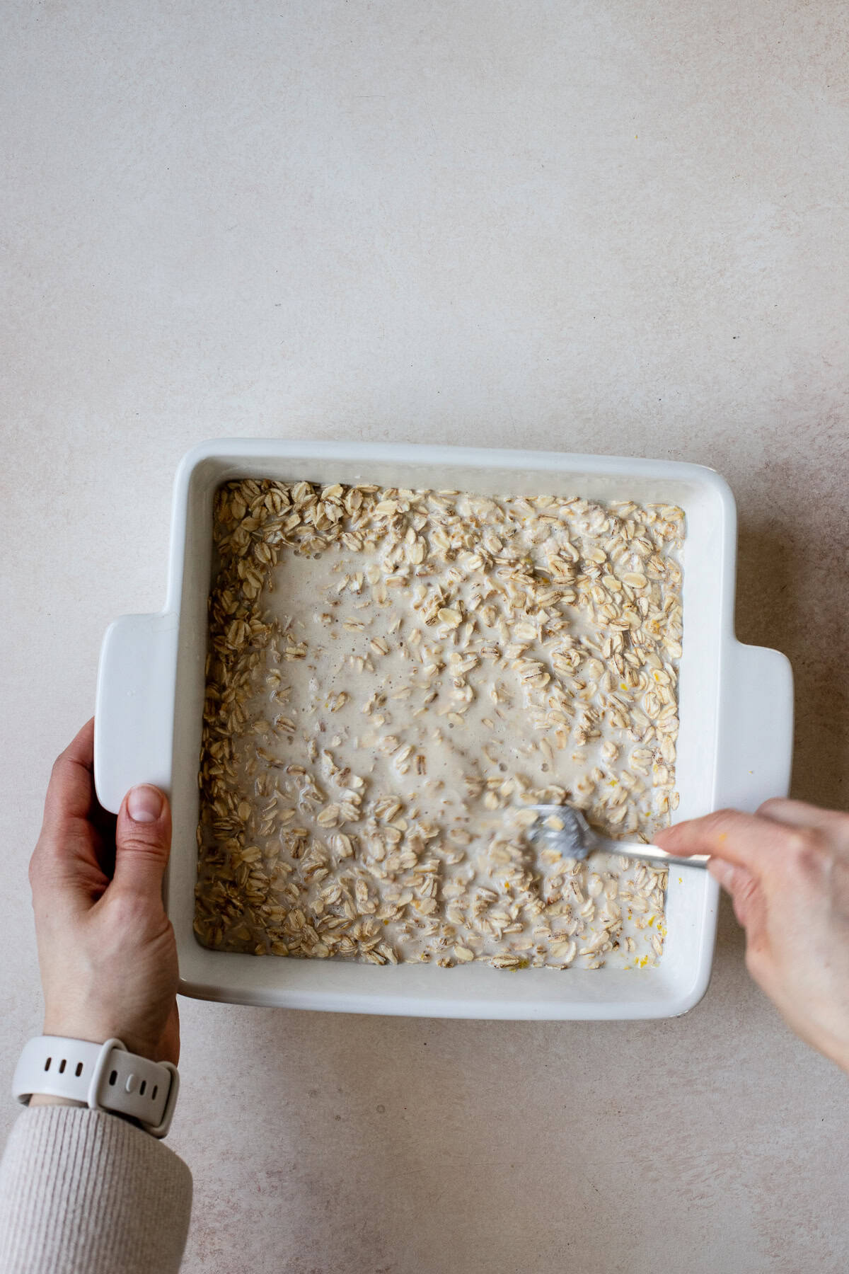 Stir baked oatmeal base ingredients together in baking dish.