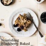 Slice of blackberry baked oatmeal on small plate with fork.