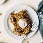 Slice of carrot cake baked oats on a plate.