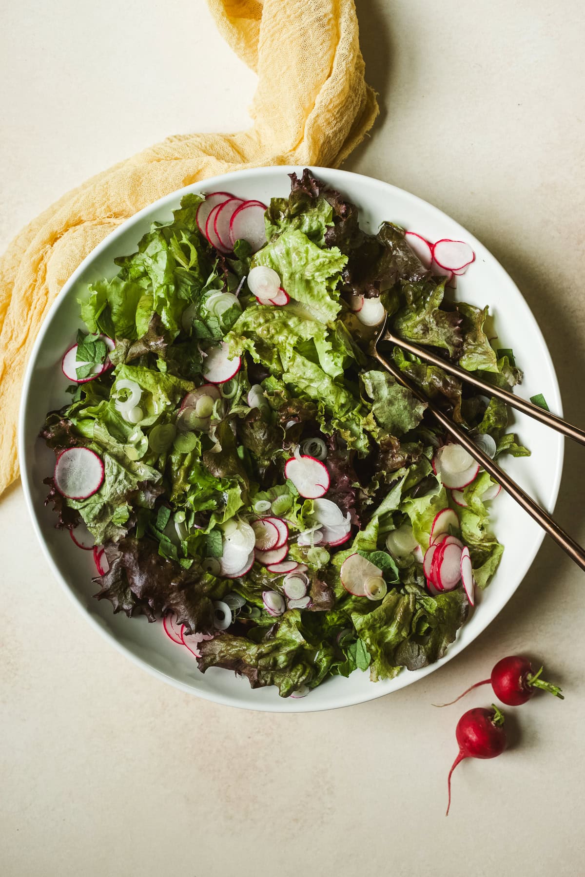 Leafy green salad in serving bowl.