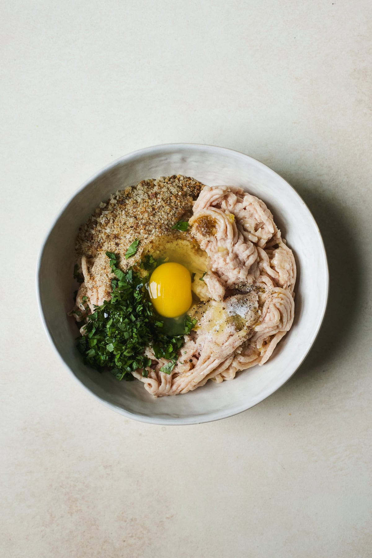 Meatball ingredients combined into one bowl.