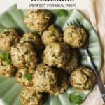 Herby baked chicken meatballs on plate.