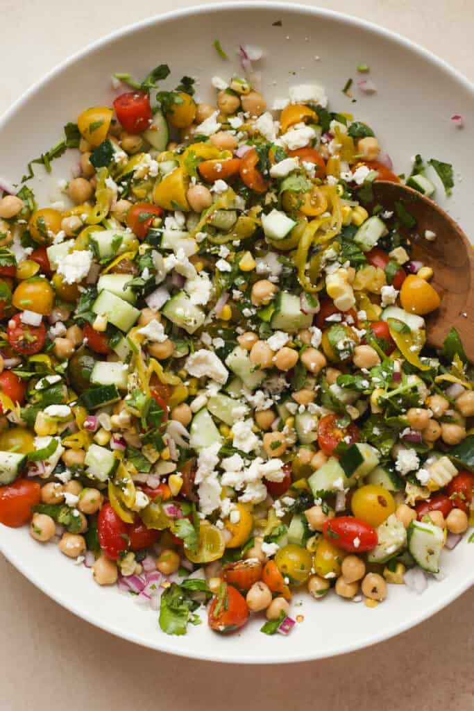 Large bowl of chickpea feta and tomato salad.