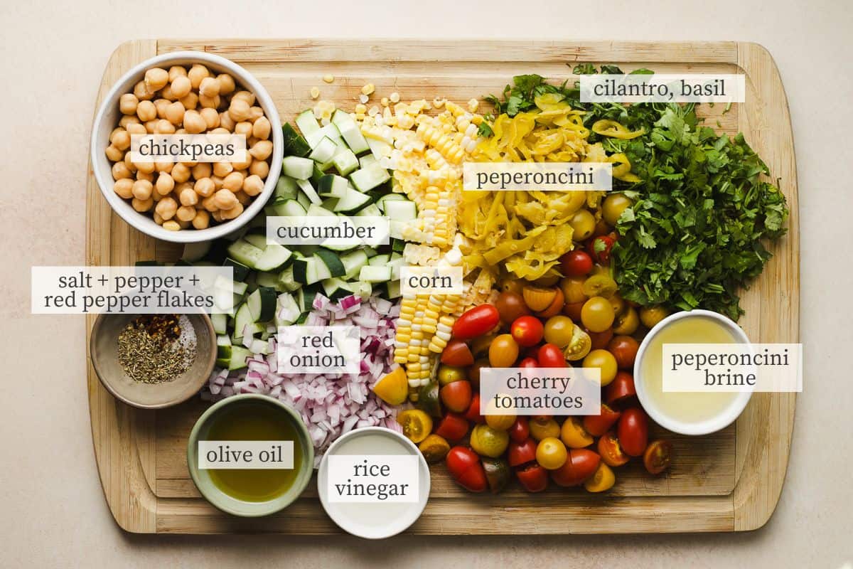 Ingredients needed for summer chickpea salad with feta and tomatoes.