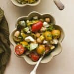 Summer chickpea salad with feta and tomatoes in a bowl.