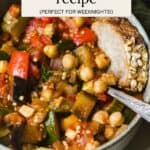 Easy ratatouille in a bowl with a slice of bread.