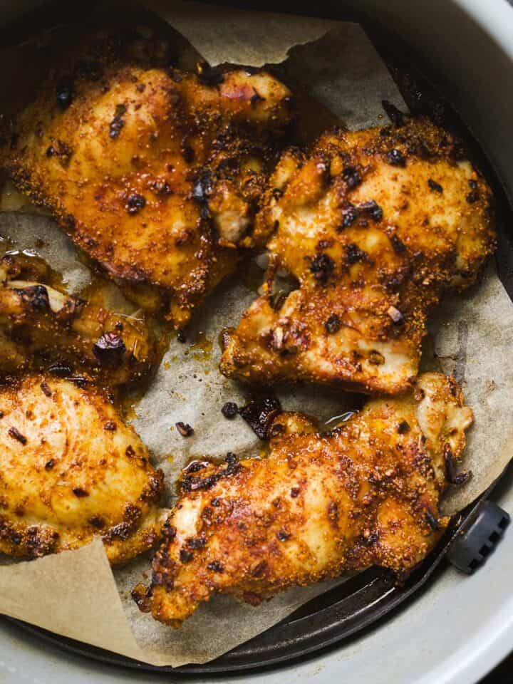 Air fryer chicken thighs with taco spices and hot honey in Ninja Foodi air fryer.