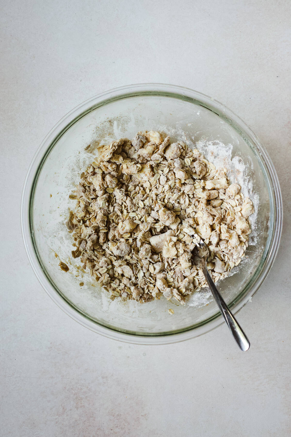 Mixing a buttery oat crisp topping for fall fruit crisp.