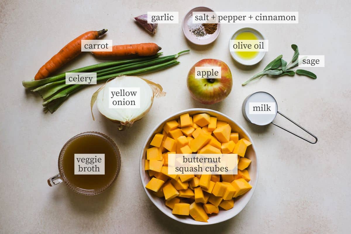 Ingredients needed for butternut squash soup with an apple.