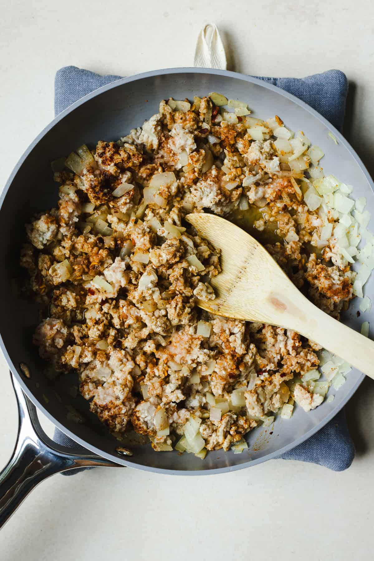 Browning onions and ground chicken with taco seasoning for ground chicken taco meat.