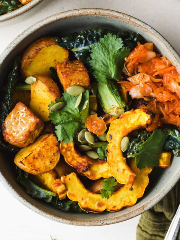 Miso curry delicata squash with tempeh in a bowl.