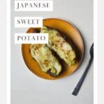 A baked Japanese purple sweet potato with butter and cinnamon on a small plate with a fork.