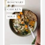 Bowl of rosemary chicken soup with white beans and kale.
