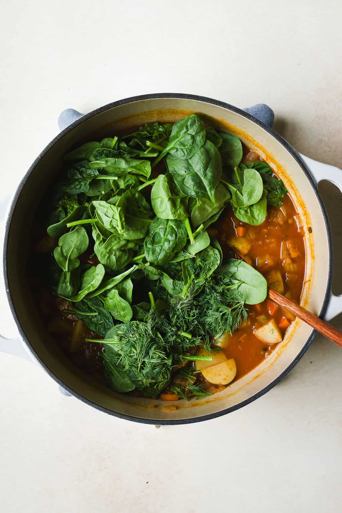 Add fresh spinach and dill to lentil soup.