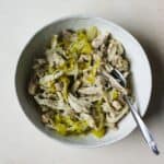 Instant Pot peperoncini chicken shredded in a bowl with a fork.