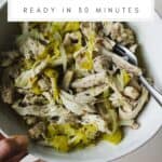 Instant Pot peperoncini chicken shredded in a bowl with a fork.