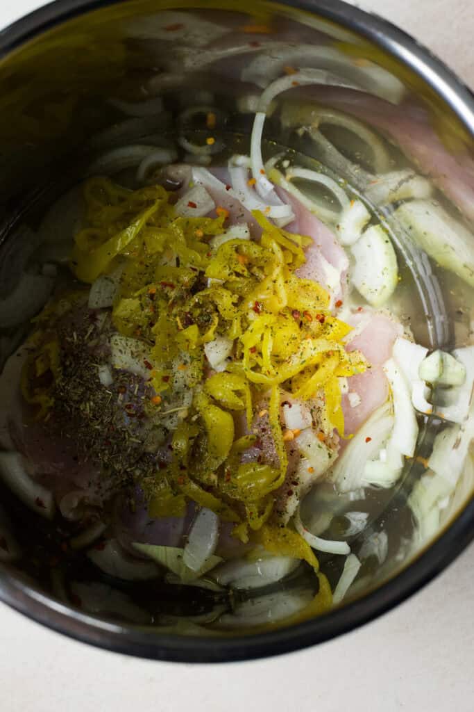 Peperoncini chicken ingredients in the Instant Pot before cooking.