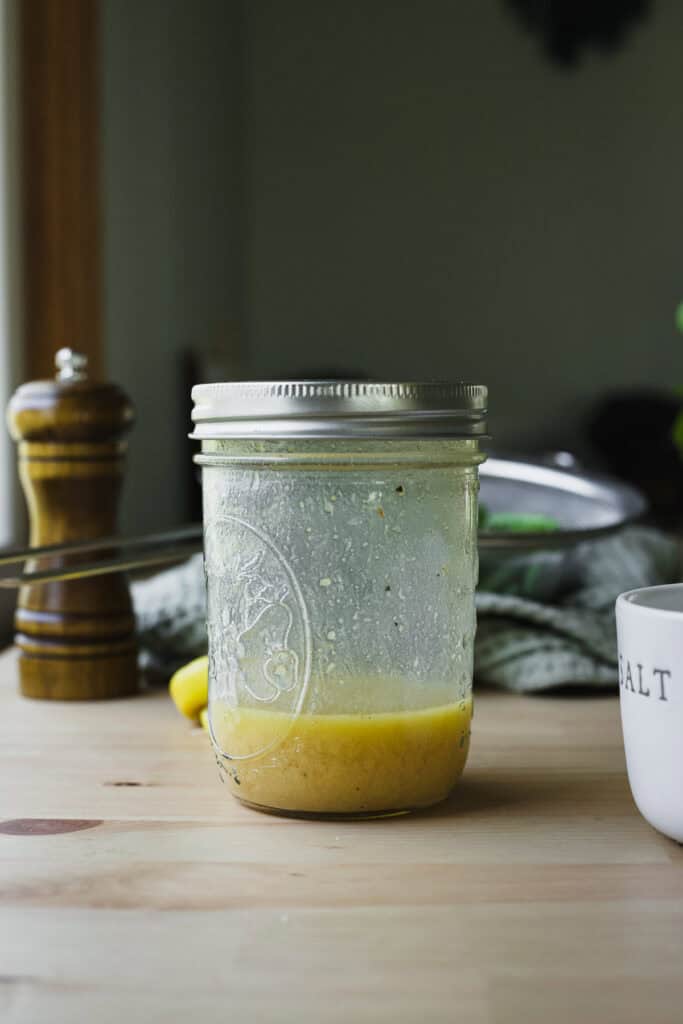 Lemony miso ginger dressing shaken together in a jar.