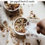 Pour milk into a bowl of homemade granola.