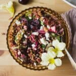 Fresh cherry salad with wheat berries in a bowl.