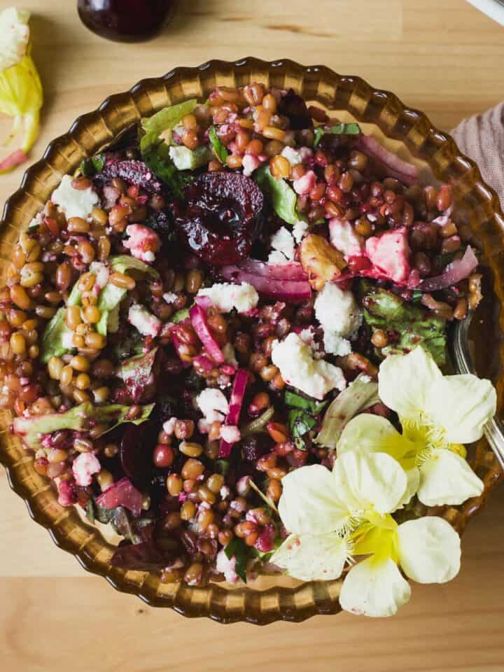 Fresh cherry salad with wheat berries in a bowl.