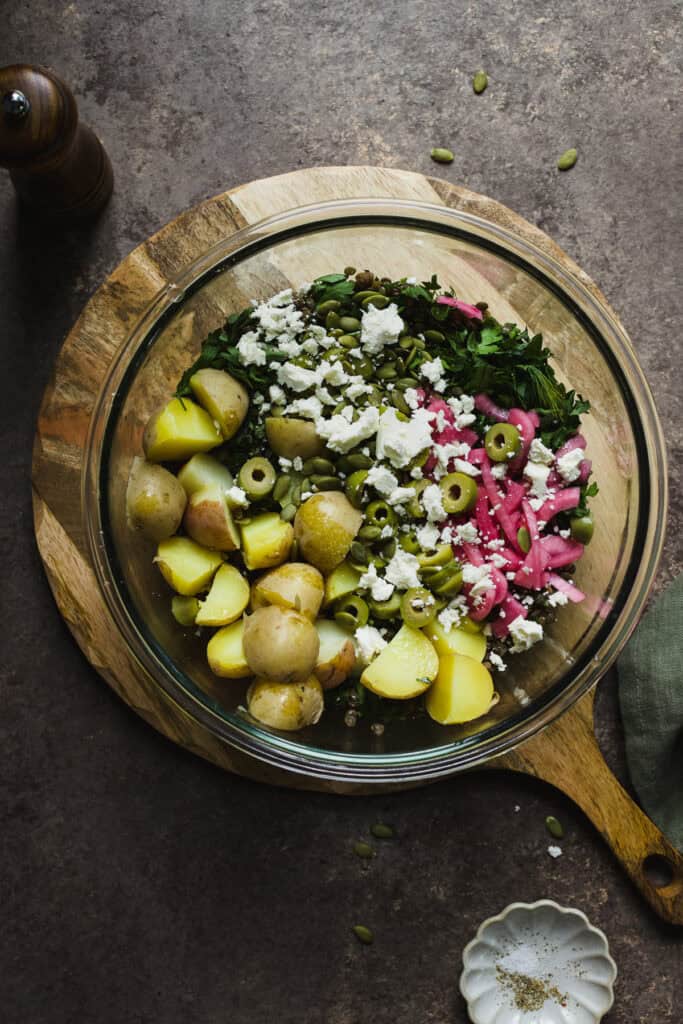 Lentil salad ingredients combined in a bowl.