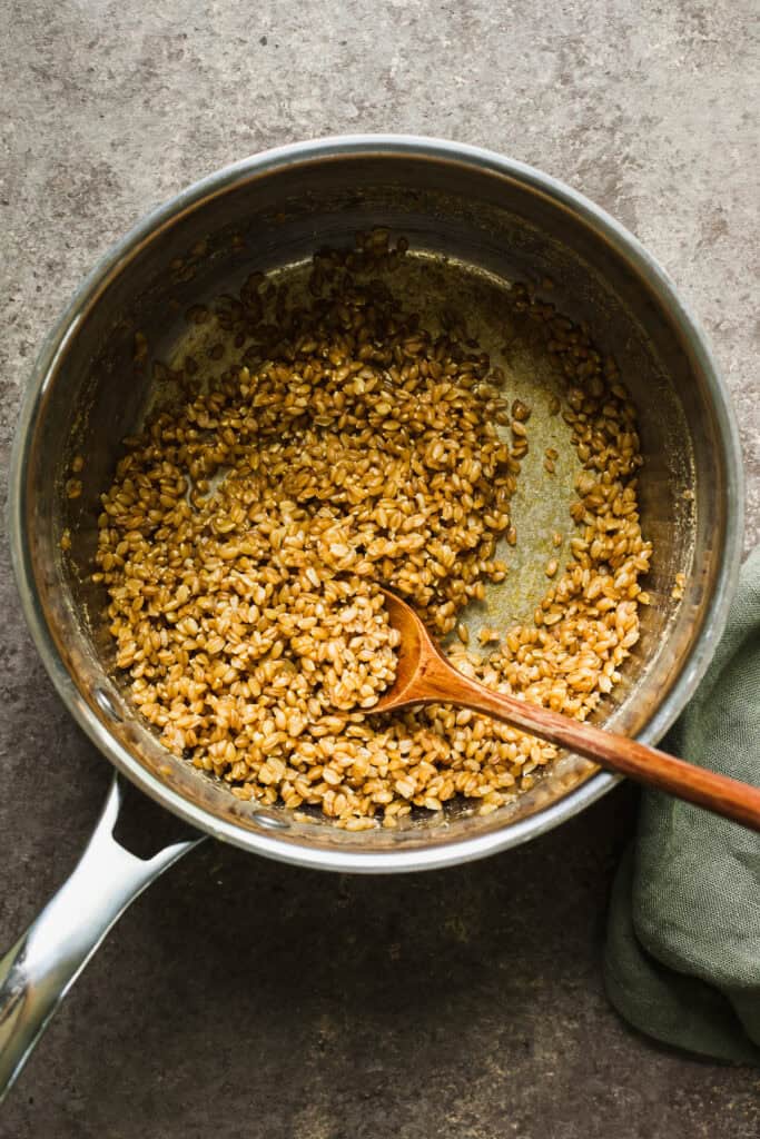 Cooked wheat berries in a pot.
