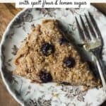 Lemon blueberry scone on a small plate with a fork.
